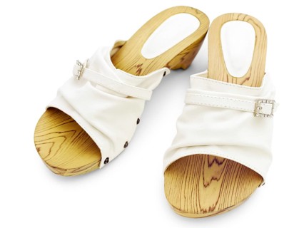 Woman's summer white shoes over white background