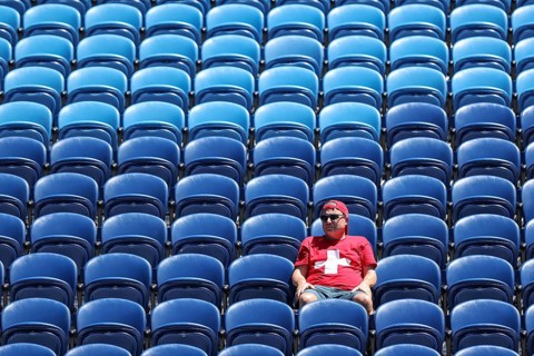 One single Swiss fan sitting in the stands watching the Australian Open 2025 junior boys singles