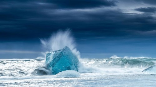 Diamond Beach, iceberg in the surf, near Jökulsarlon glacier lagoon, Vatnajökull National Park,