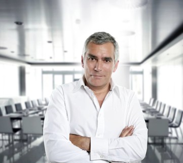 Senior expertise gray hair businessman posing interior white modern office