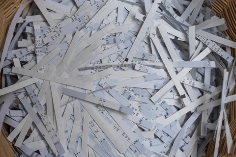 Shredder has destroyed top secret data - close-up of paper shredder