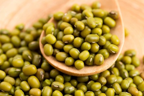 Mung beans over wooden spoon, lodz, poland