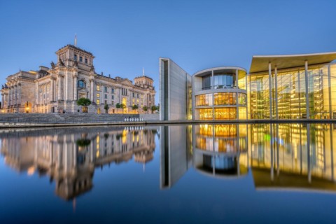 The Reichstag and part of the Paul Löbe House on the Spree in Berlin at dusk