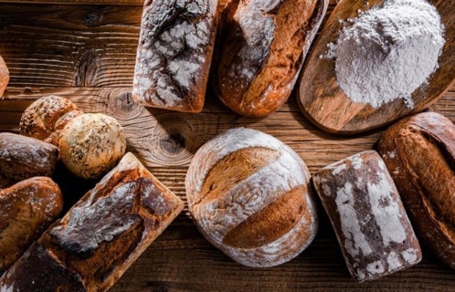 Composition with assorted bakery products on wooden table
