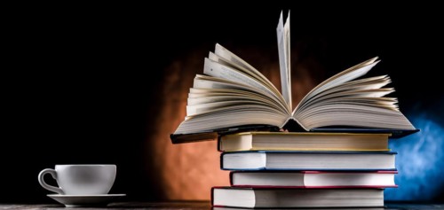 A composition with books and a cup of coffee