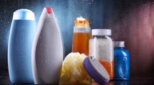Different containers of body care products in the bathroom