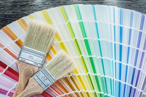 Color sampler paintbrushes on wooden board