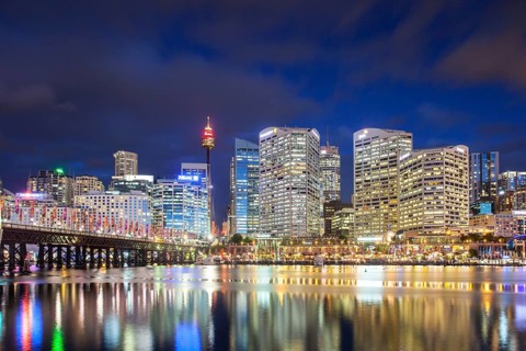 Sydney skyline and Pyrmont bridge at dusk near Darling Harbour, in Sydney Australia