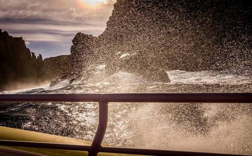 View from tour boat with handrail on Tasman Island, Tasmania, Australia, Oceania