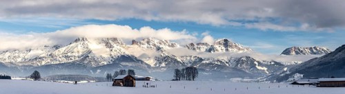 Snowy mountains, meadow and a hut, landscape in Austria, panorama
