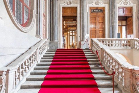 Turin, Italy - Circa January 2022: red carpet in Royal Palace - luxury elegant marble stairway