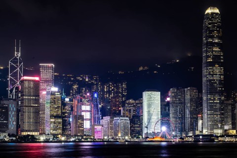HONG KONG, CHINA - SEPTEMBER 27 2024: Night time view of Hong Kong Island and Victoria Harbour from