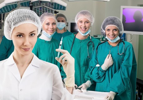 Young female anesthetist with syringe on the surgery teem background