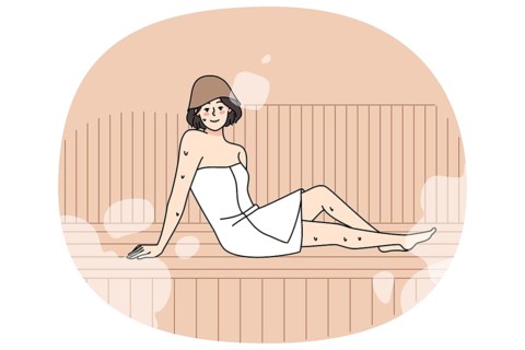 Happy young woman in towel relax in sauna enjoy bodycare procedures. Smiling girl rest in bathhouse