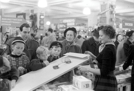 Toys in the 1950s. Interior from the NK department store in Stockholm. A clerk in the toy