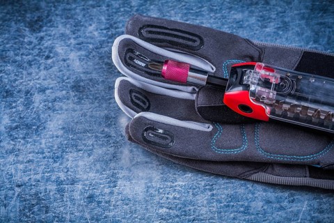 Muunction toolbox staff safety gloves on metallic background