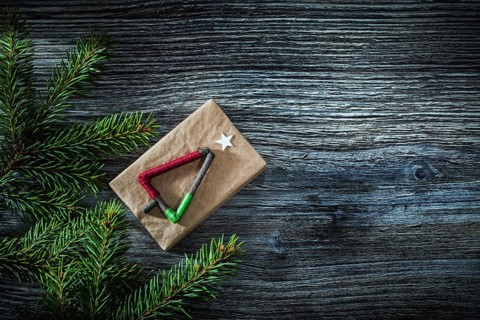 Pine tree branches gift box on wooden board