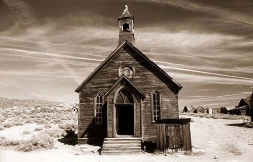 This small chapel made of weather-beaten boards stands on the edge of a dusty road in Bodie. Photo