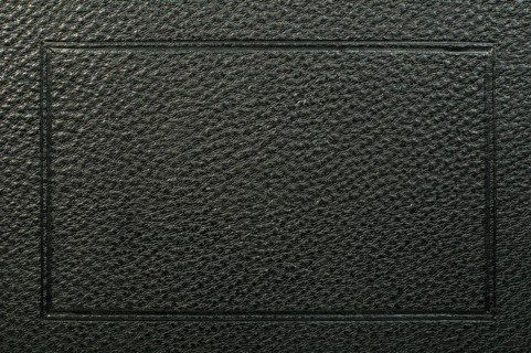Old vintage black leather background. Studio shot