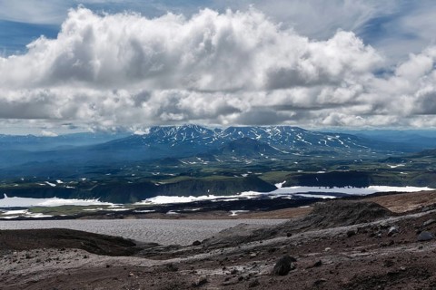 Beautiful mountain (volcanic) cloudy landscape of Kamchatka Peninsula. Asia, Russian Far East