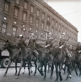 1940s soldiers on horses. In the street with the royal castle in Stockholm in the background,