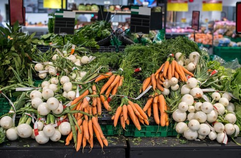 Carrots and onions in supermarket