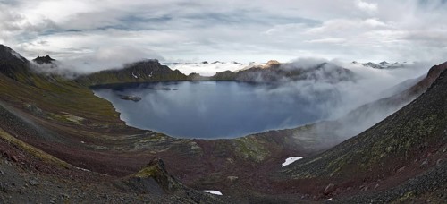 Scenery panorama landscape of Kamchatka Peninsula: view of beautiful mountain lake in crater active