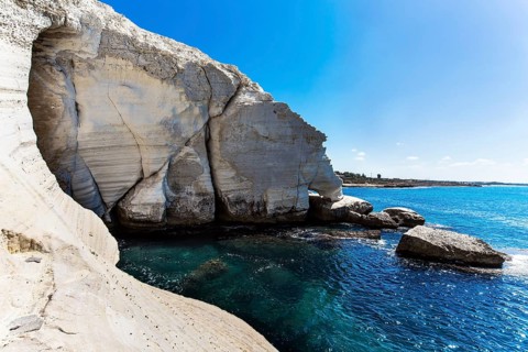 Magnificent color of sea water - from turquoise to dark blue. Grottoes Rosh a Nikra - geological