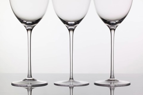 Three empty glasses of wine on a clean background