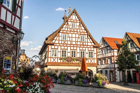 Neubulach, Baden-Württemberg, Germany, Charming half-timbered old town with lush floral decorations