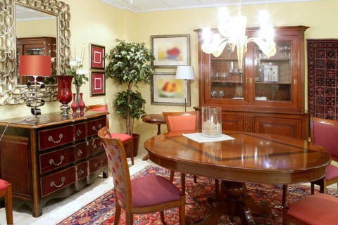 Classic living room table warm wood furniture glowing chandelier