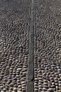Rolling stones pavement soil texture in Altea Alicante mediterranean village of Spain