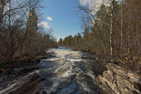 Nellim log flume in spring with clouds in the sky, Nellim, Inari, Lapland, Finland, Europe