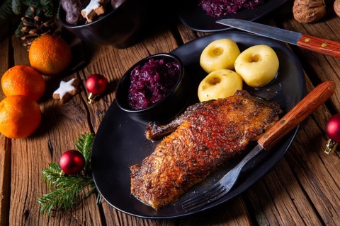 Classic and crispy roast duck with cabbage and dumplings