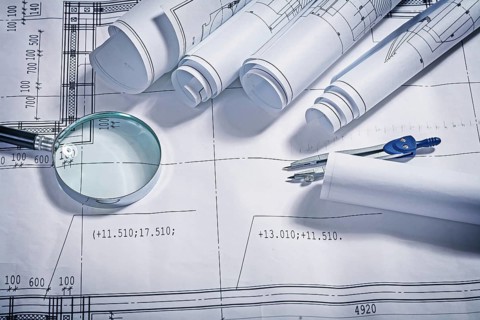 Blueprints magnifer and compass close up
