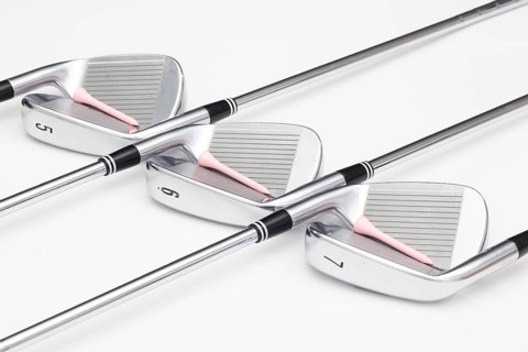 Titanium golf clubs on the white background