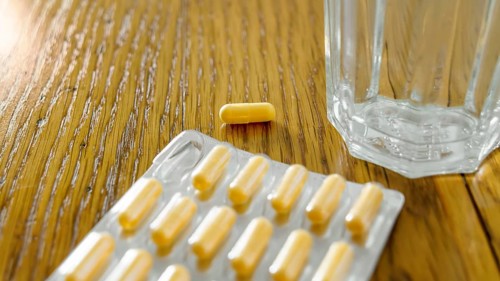 An image of some yellow pills in a blister pack