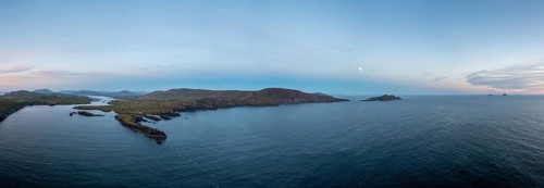 Panorama drone view of the Iveragh Peninsula with Valentia Island and Portmagee at sunset