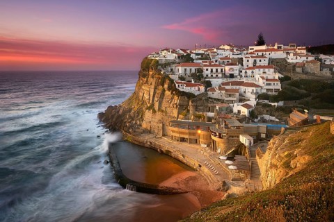 Azenhas do Mar traditional picturesque village in Portugal at sunset