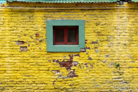 Colourful wall with windows in the La Boca district, Buenos Aires Argentina