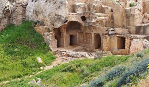 Carved chambers and steps cut into rock in the tomb of the kings area of paphos cyprus