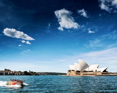 Famous sydney landmark opera house view with speed boat in australia on sunny day