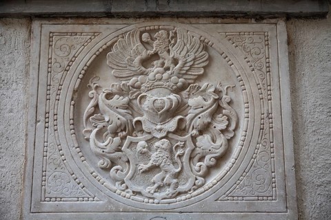 Coat of arms, stone relief on a gravestone, exterior facade of the cathedral, Graz, Styria,