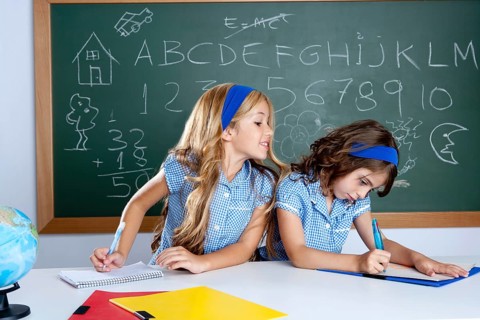 Classroom with two kids students cheating on test exam at school