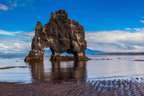 The picturesque cliff in Iceland as huge prehistoric monster. Remains of an ancient extinct volcano