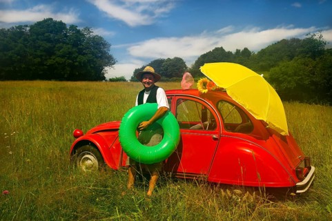Typical French man is going to the beach with his typical classic car