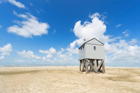 Drowning house at the beach from Dutch wadden island Terschelling