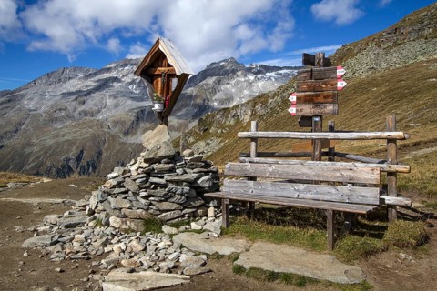 Wayside shrine with bench in the mountains of South Tyrol, Italy, Europe