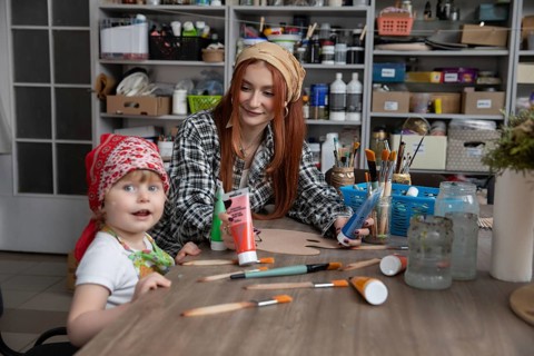 A delightful art session where a mother and child engage in creative activities, showcasing bonding
