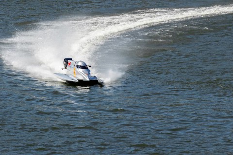 PESO DA REGUA, PORTUGAL - SEPTEMBER 15, 2024: Gray Powerboat Making Turn with Splashes of Water